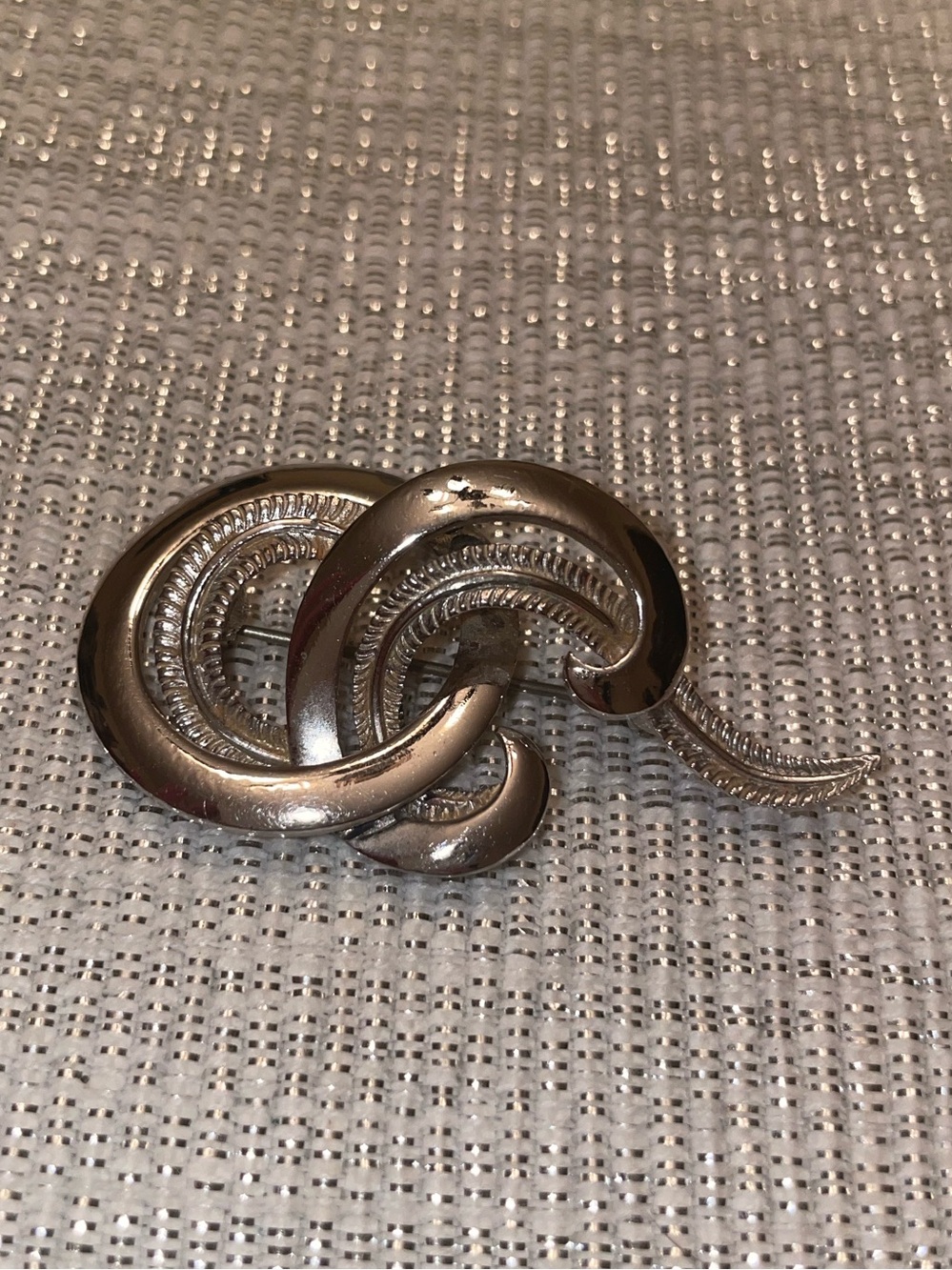Monet Silver-Tone Interlocking Knot Brooch.